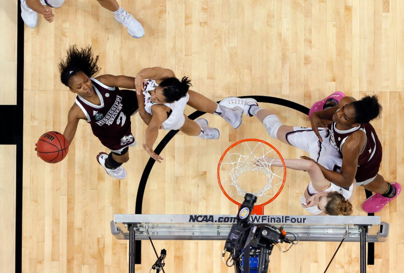 Mississippi State's Morgan William (2) takes a shot over Connecticut's Gabby Williams,...