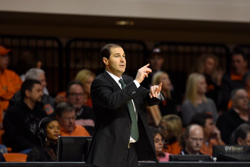 Baylor head coach Scott Drew signals his team during a NCAA college basketball game in...