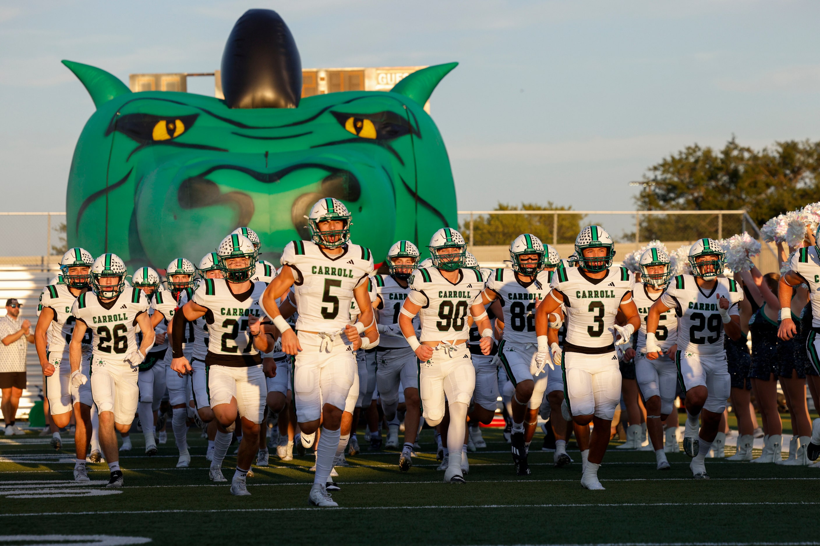 Southlake Carroll takes the field before the first half of a District 4-6A game against...