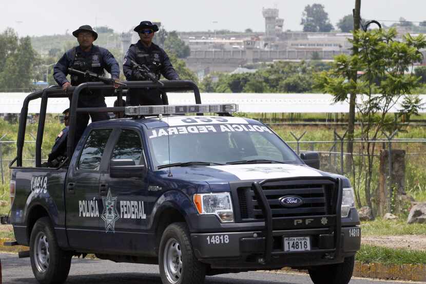A unit of the Mexican Federal Police patrols the surroundings of the Puente Grande State...