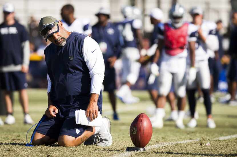 Dallas Cowboys special teams coach Rich Bisaccia keeps his eye on the ball during afternoon...
