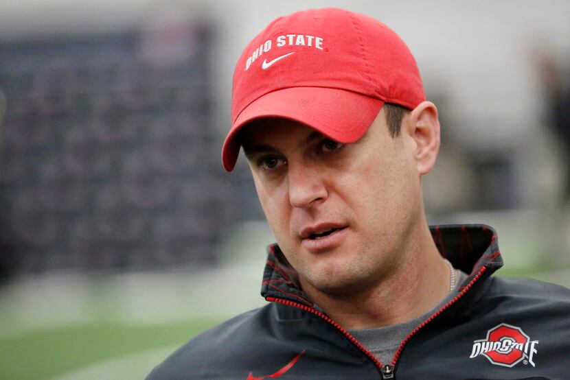 Ohio State offensive coordinator Tom Herman speaks to reporters during media day for Oregon...