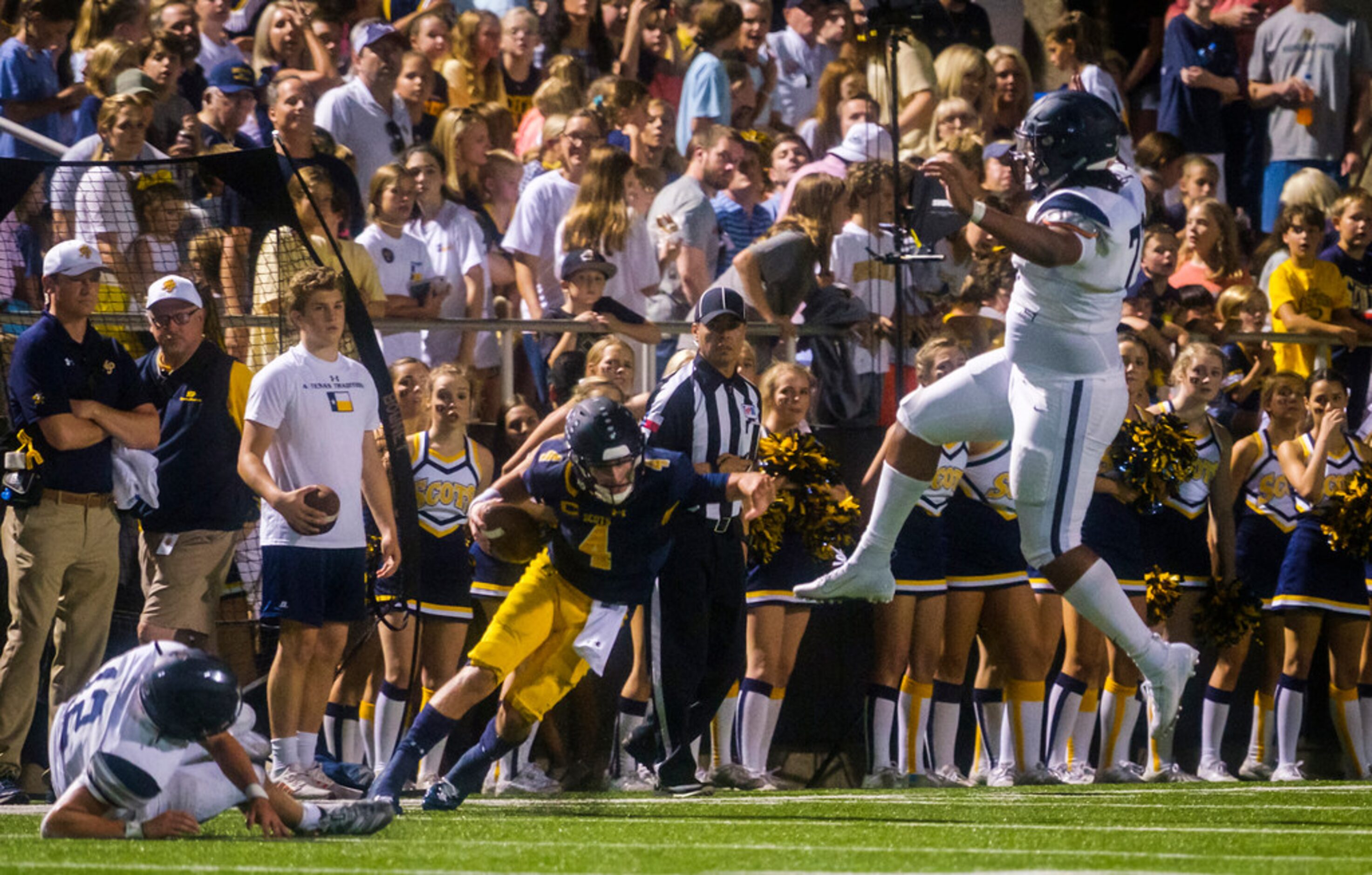 Frisco Lone Star linebacker Blake Gotcher (12) and Jaiden Jones (77) chase down Highland...