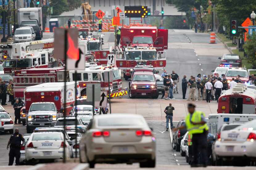 Emergency personnel respond to a reported shooting at the Washington Navy Yard, Monday,...