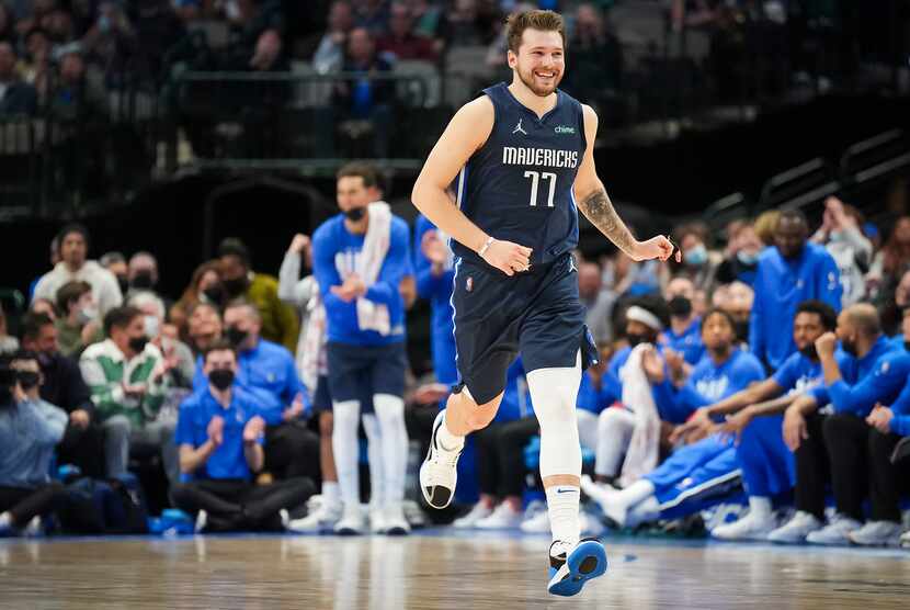 Dallas Mavericks guard Luka Doncic celebrates after scoring his 49th point of the game...