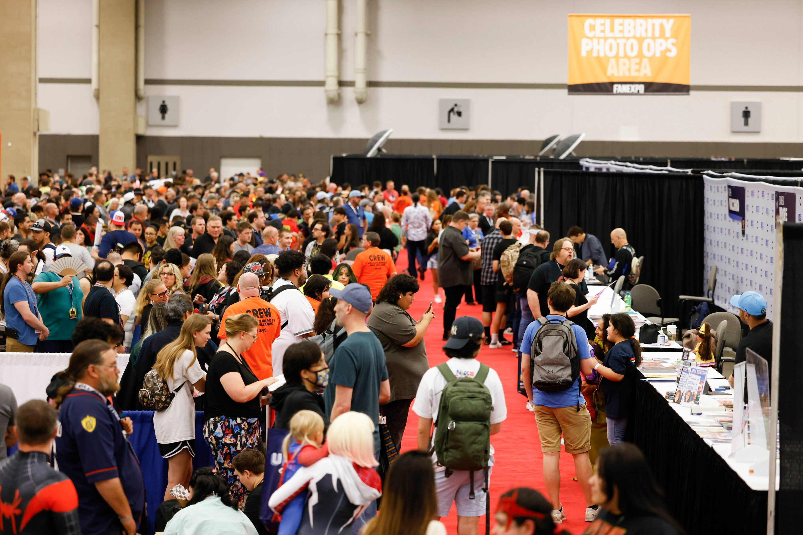 Fans gather to get autographs from celebrities during Fan Expo Dallas on Friday, June 9,...