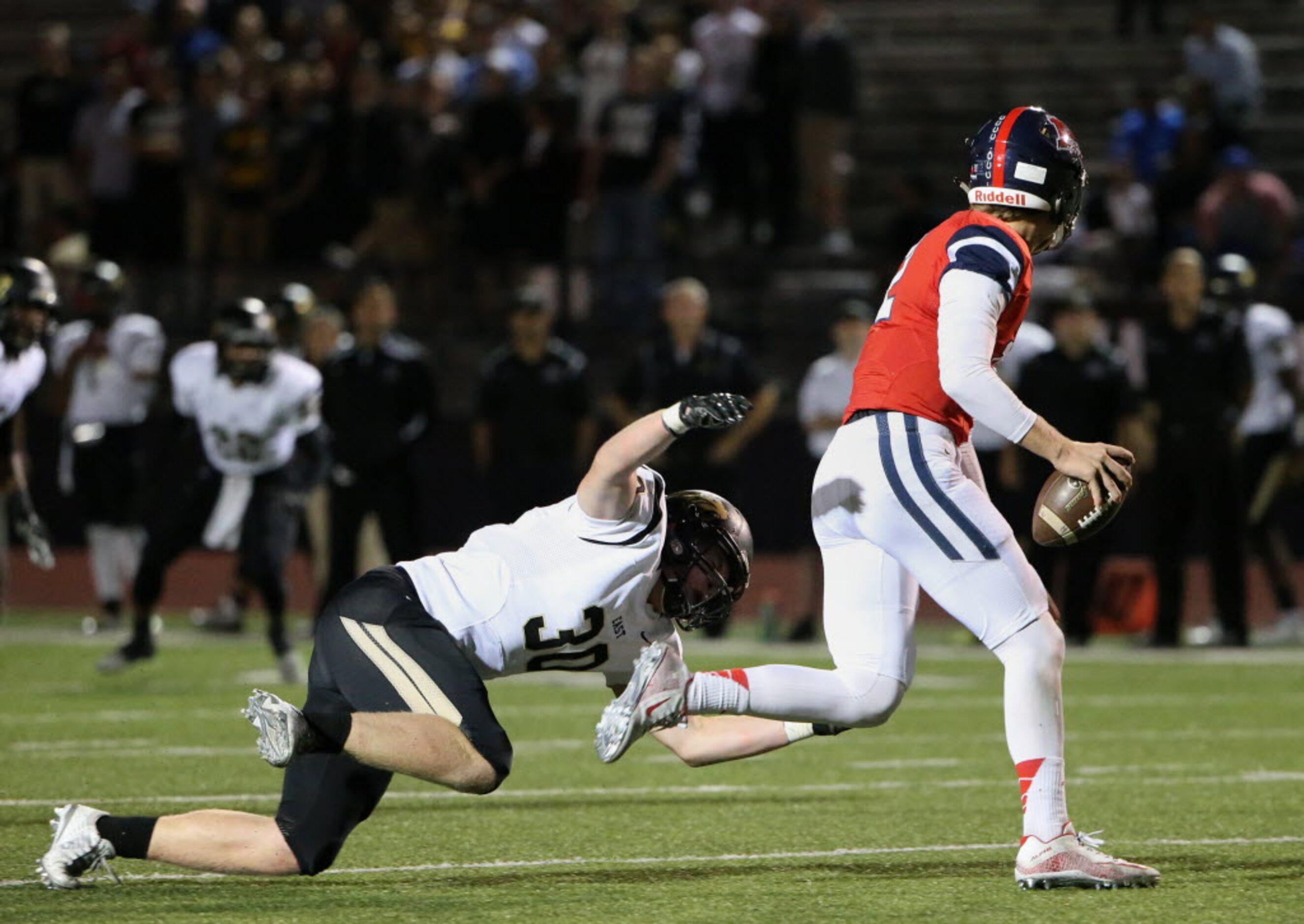 Plano East defensive lineman Grayson Diepenbrock (30) sacks McKinney Boyd quarterback Grant...