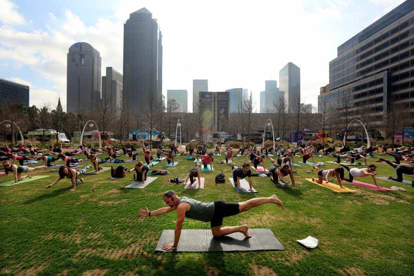 The backdrop for a yoga class at Klyde Warren Park is pretty amazing.