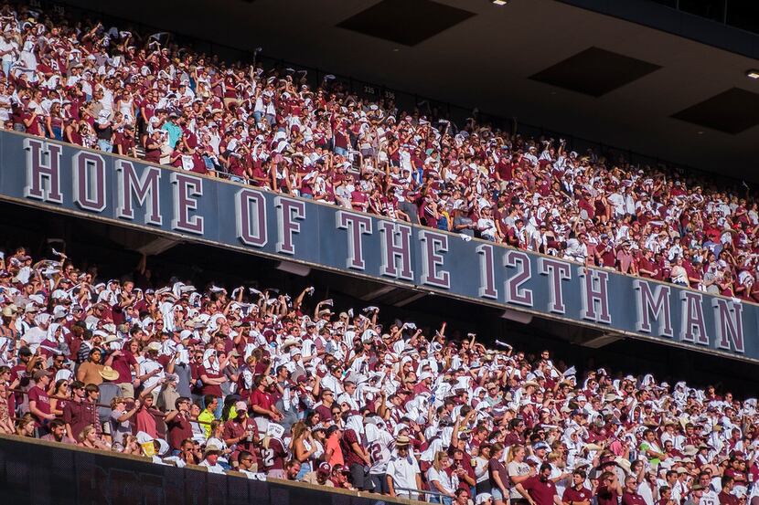 Texas A&M fans cheer their team during the second half of an NCAA football game against...