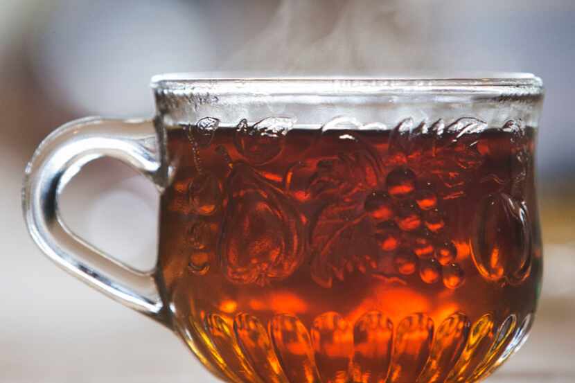 Steam rises from a cup of tea during a tea party at Dude, Sweet Chocolate's headquarters in...