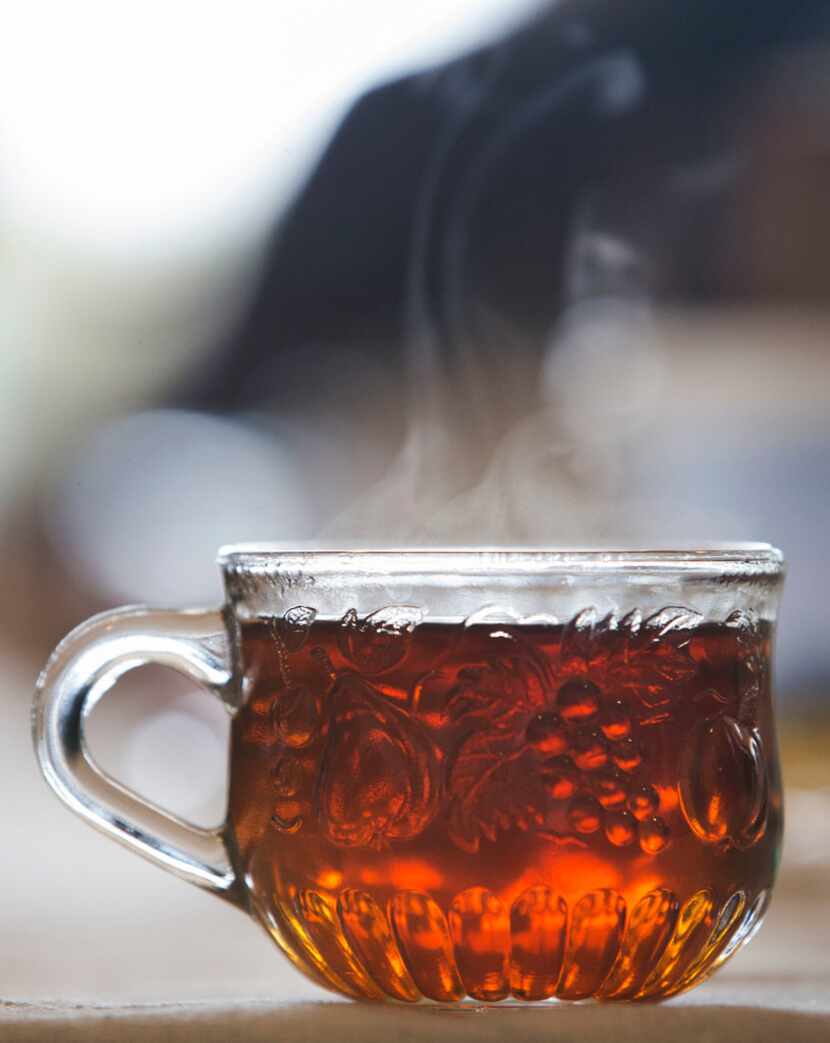 Steam rises from a cup of tea during a tea party at Dude, Sweet Chocolate's headquarters in...