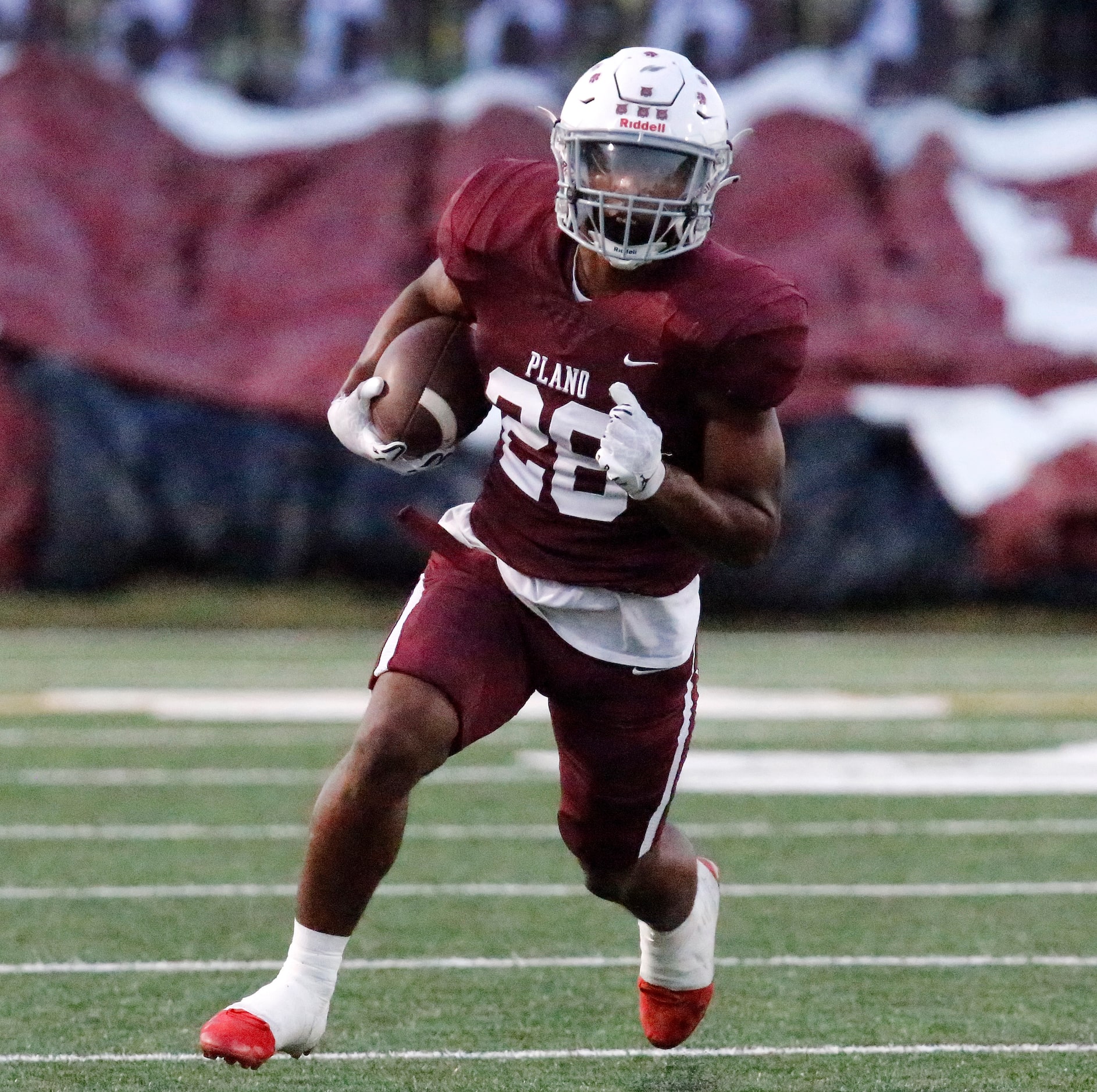 Plano Senior High School running back Kameron Jones (26) carries the ball during the first...