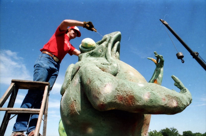 Jerry Hudson of Carl's Corner truck stop does some large-scale frog dissection on one of the...