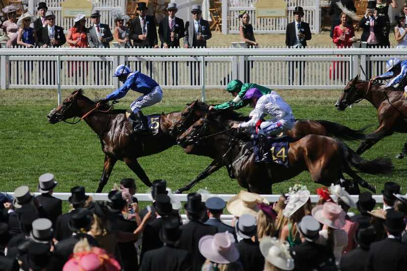 Horses race during the Commonwealth Cup on day four of the Royal Ascot horse racing meet, in...