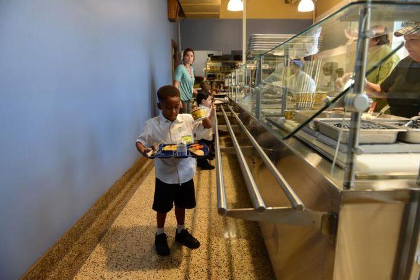 Sean Campbell gets lunch from the recently renovated kitchen on the first day of school.