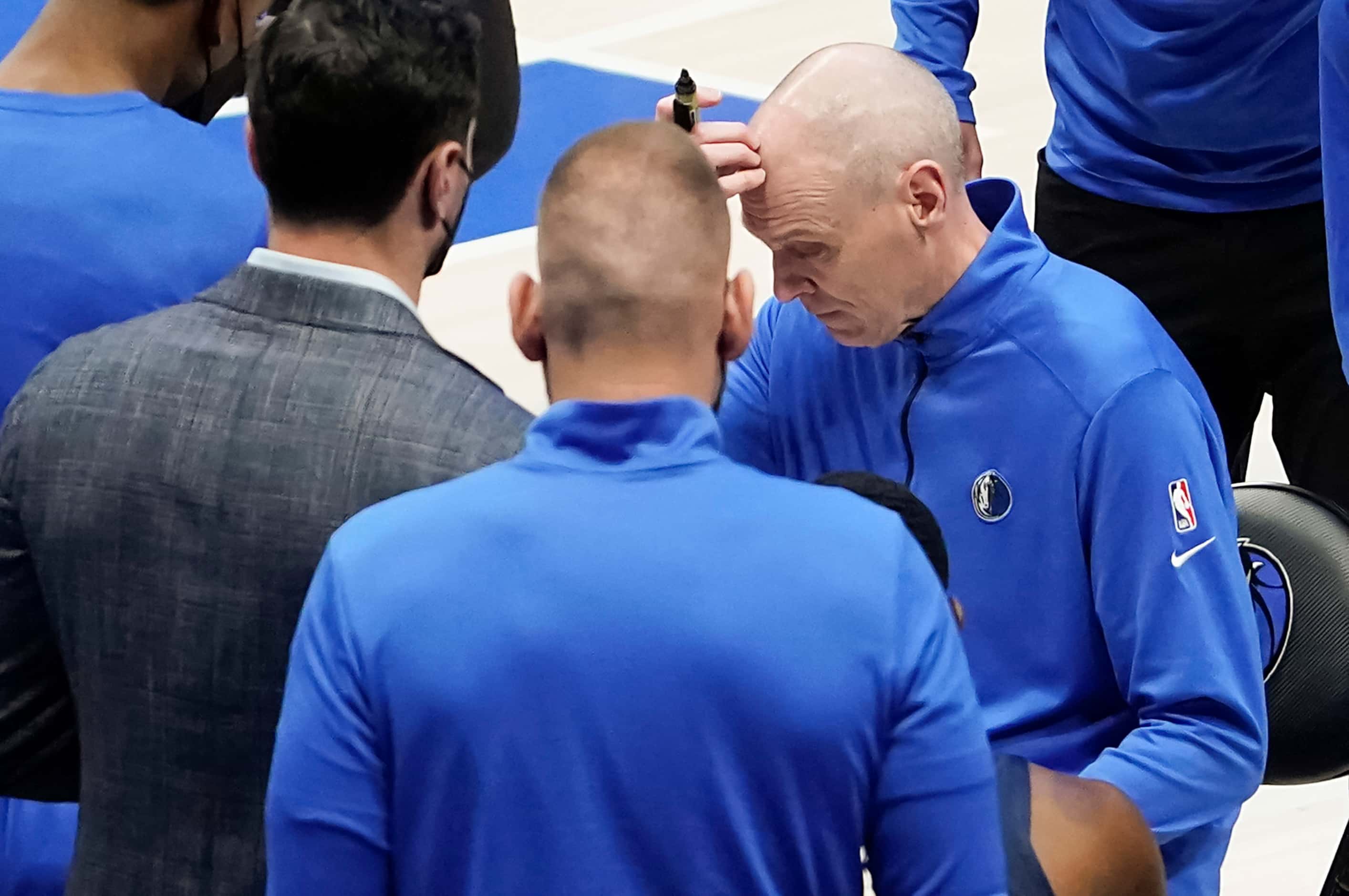 Dallas Mavericks head coach Rick Carlisle scratches his head during a time out in the third...