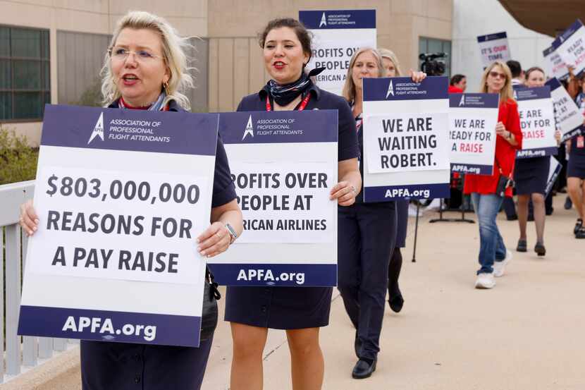Members of the Association of Professional Flight Attendants picketed at DFW International...