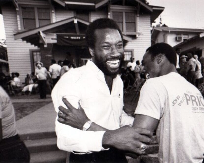 John Wiley Price and Michael Caldwell embraced after Price's 1984 election victory.