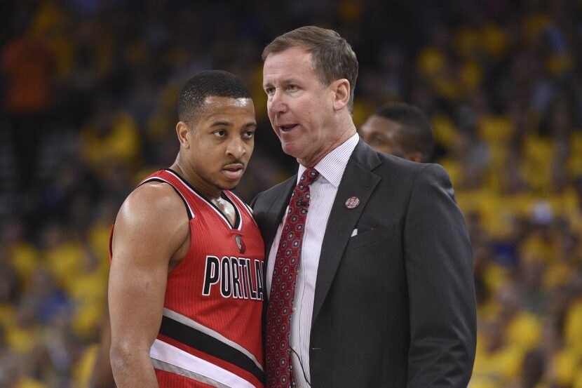 Portland Trail Blazers head coach Terry Stotts (right) instructs guard C.J. McCollum (3)...