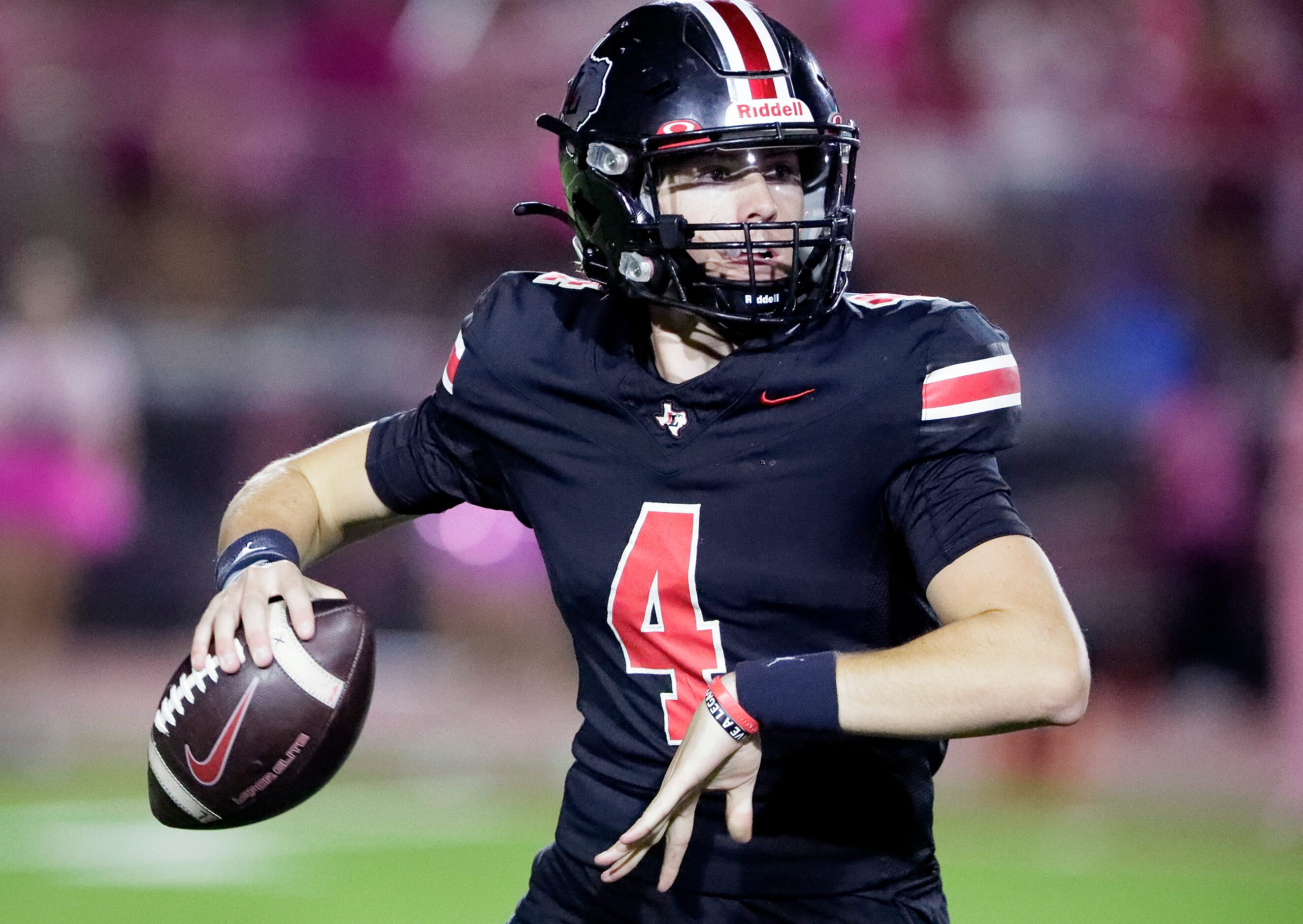 Lovejoy High School quarterback Jacob Janecek (4) throws a pass during the first half as...