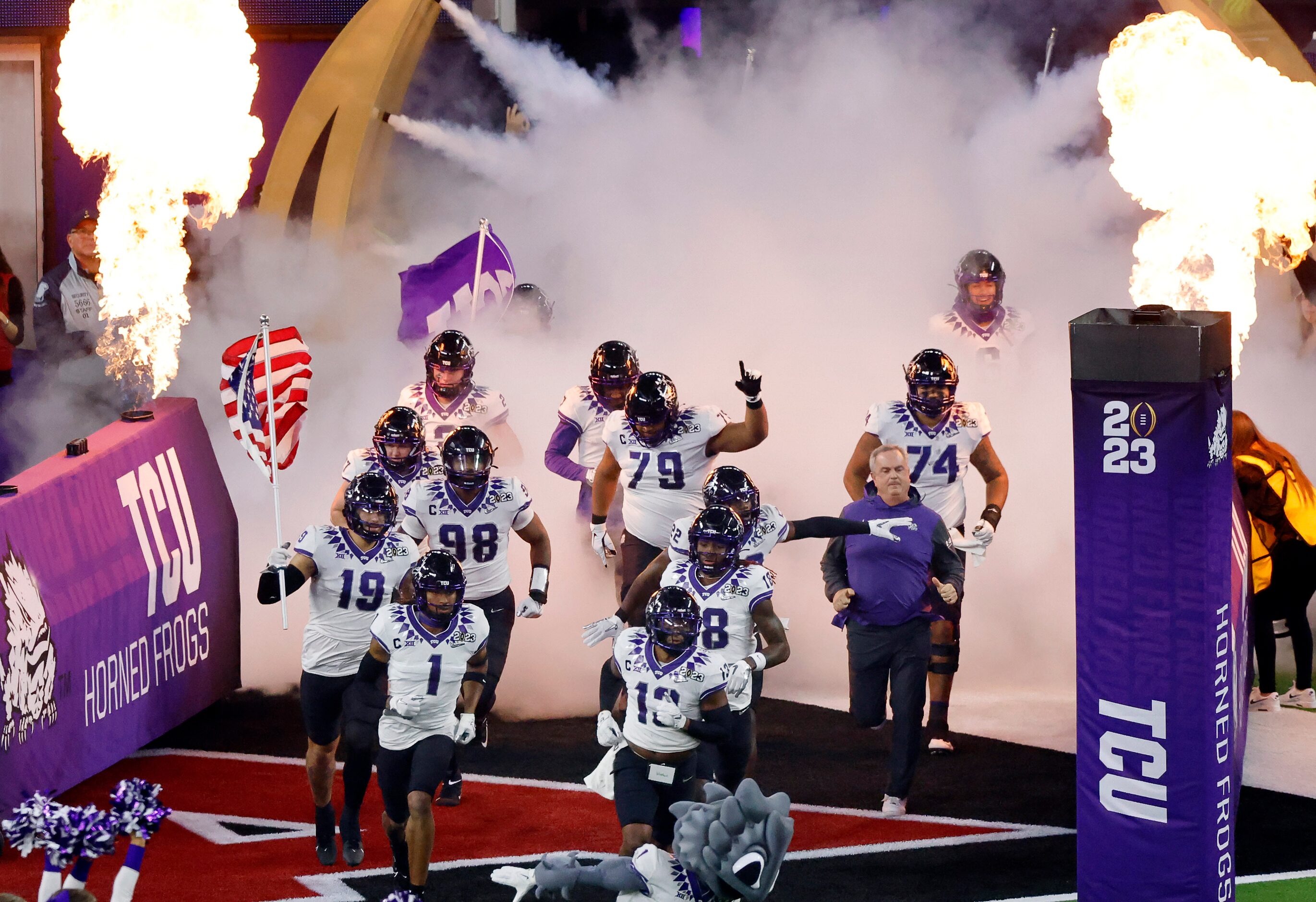 TCU Horned Frogs head coach Sonny Dykes and his players take the field to face the Georgia...