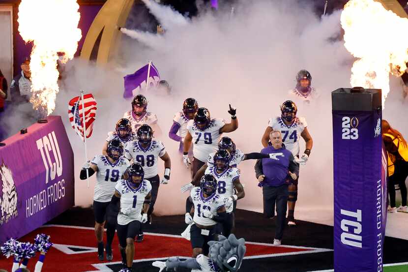 TCU Horned Frogs head coach Sonny Dykes and his players take the field to face the Georgia...