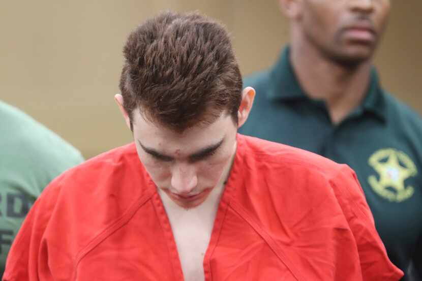 Nikolas Cruz is lead out of the courtroom after an arraignment hearing at the Broward County...