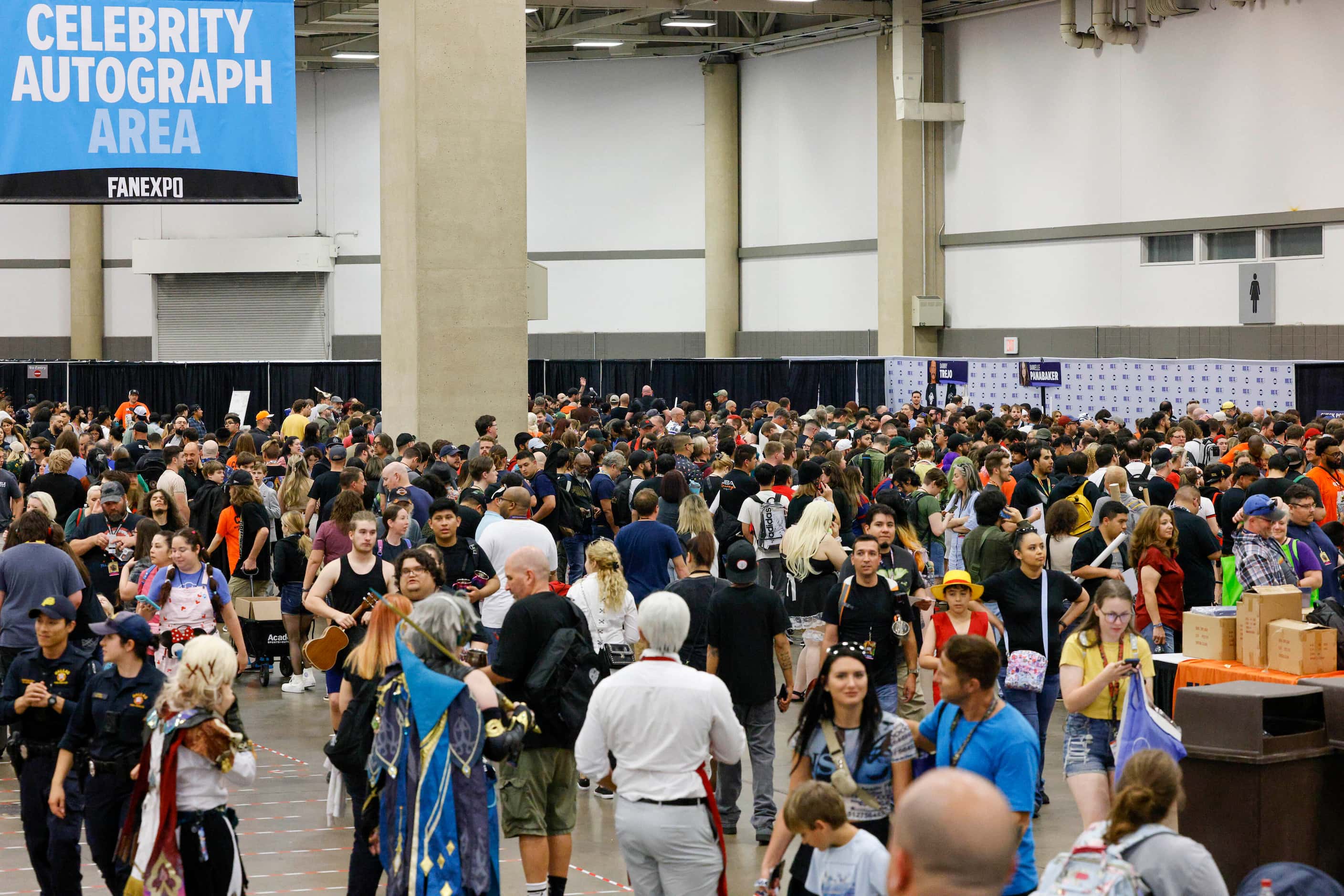 Hundreds of attendees wait in line for autographs and photographs with actors at Fan Expo...