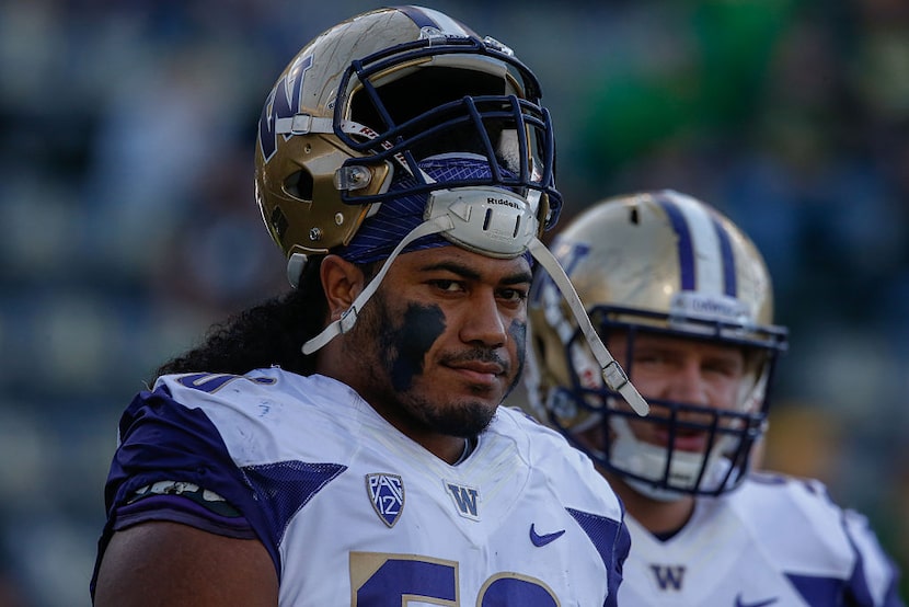 EUGENE, OR - OCTOBER 08:  Defensive lineman Vita Vea #50 of the Washington Huskies looks on...