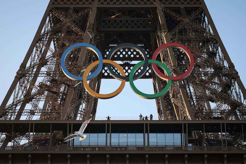 FILE - The Olympic rings are mounted on the Eiffel Tower Friday, June 7, 2024 in Paris.  (AP...