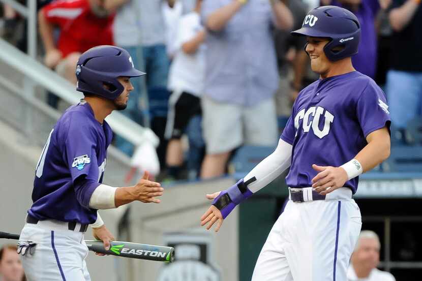 Jun 18, 2015; Omaha, NE, USA; TCU Horned Frogs infielder Derek Odell (5) and outfielder Dane...