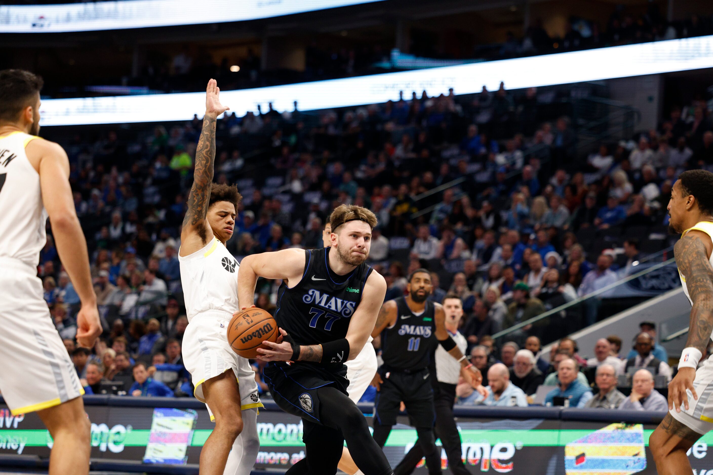 Dallas Mavericks guard Luka Doncic (77) drives past Utah Jazz guard Keyonte George (3)...