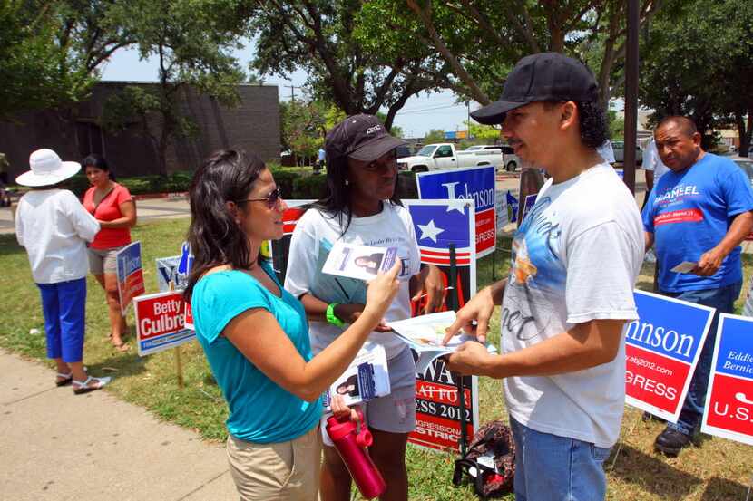 Maricela Moore, left, works her own campaign for 162nd Civil District Court with the help of...
