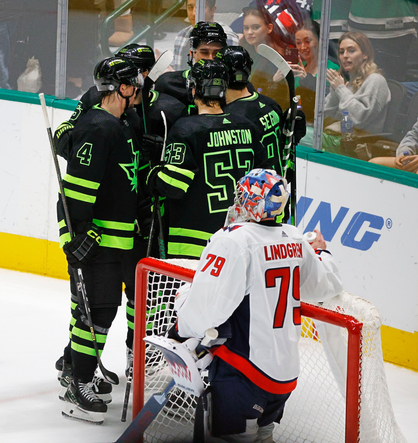 Dallas Stars left wing Mason Marchment (27), back center, celebrates with his teammates...