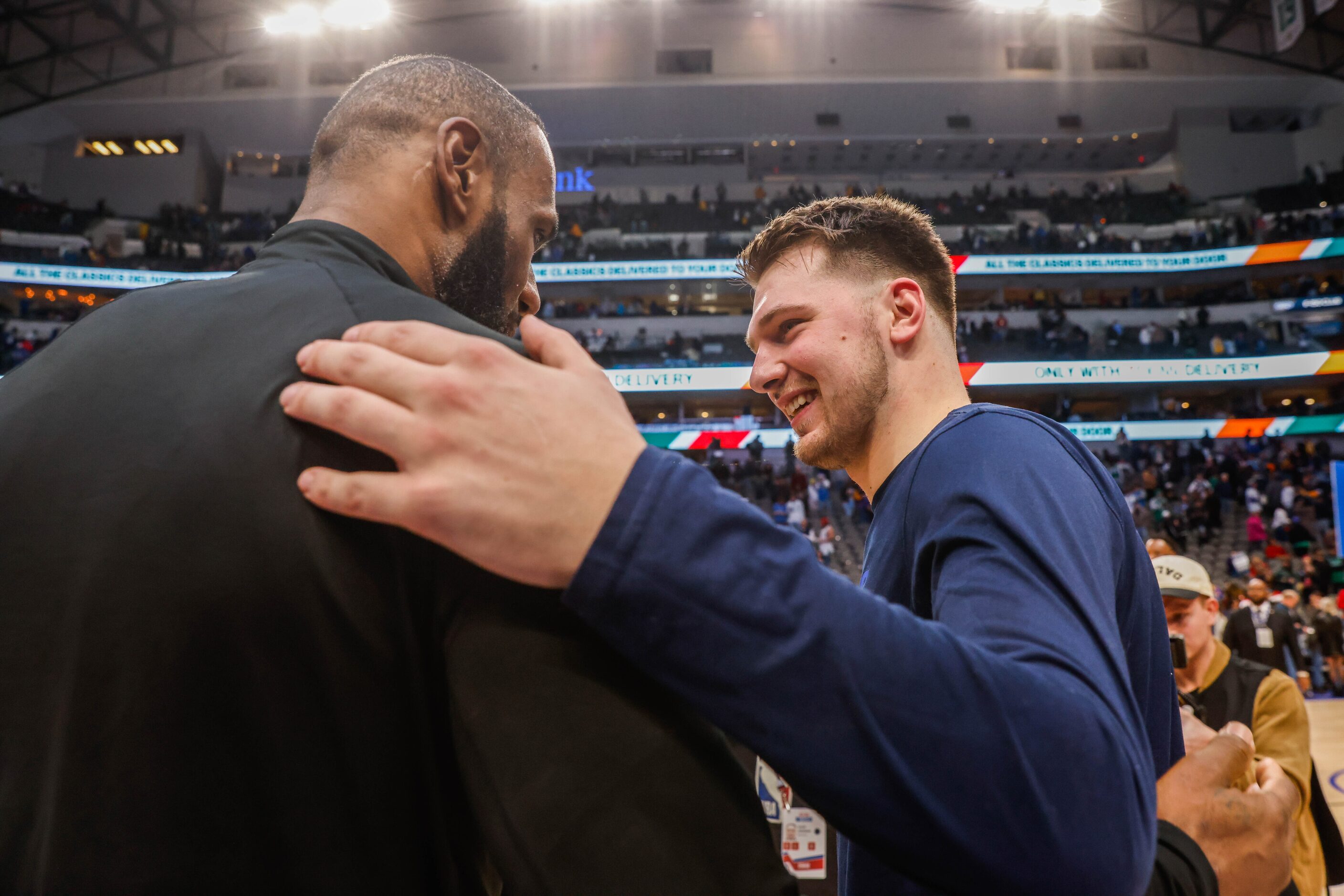 Dallas Mavericks guard Luka Doncic (77) talks with Los Angeles Lakers forward LeBron James...