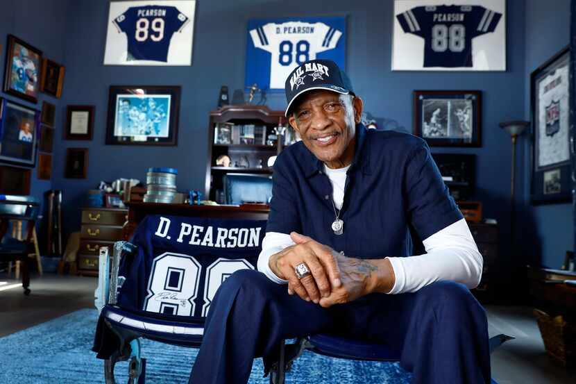 Pro Football Hall of Fame inductee Drew Pearson poses for a photo on Texas Stadium seats...