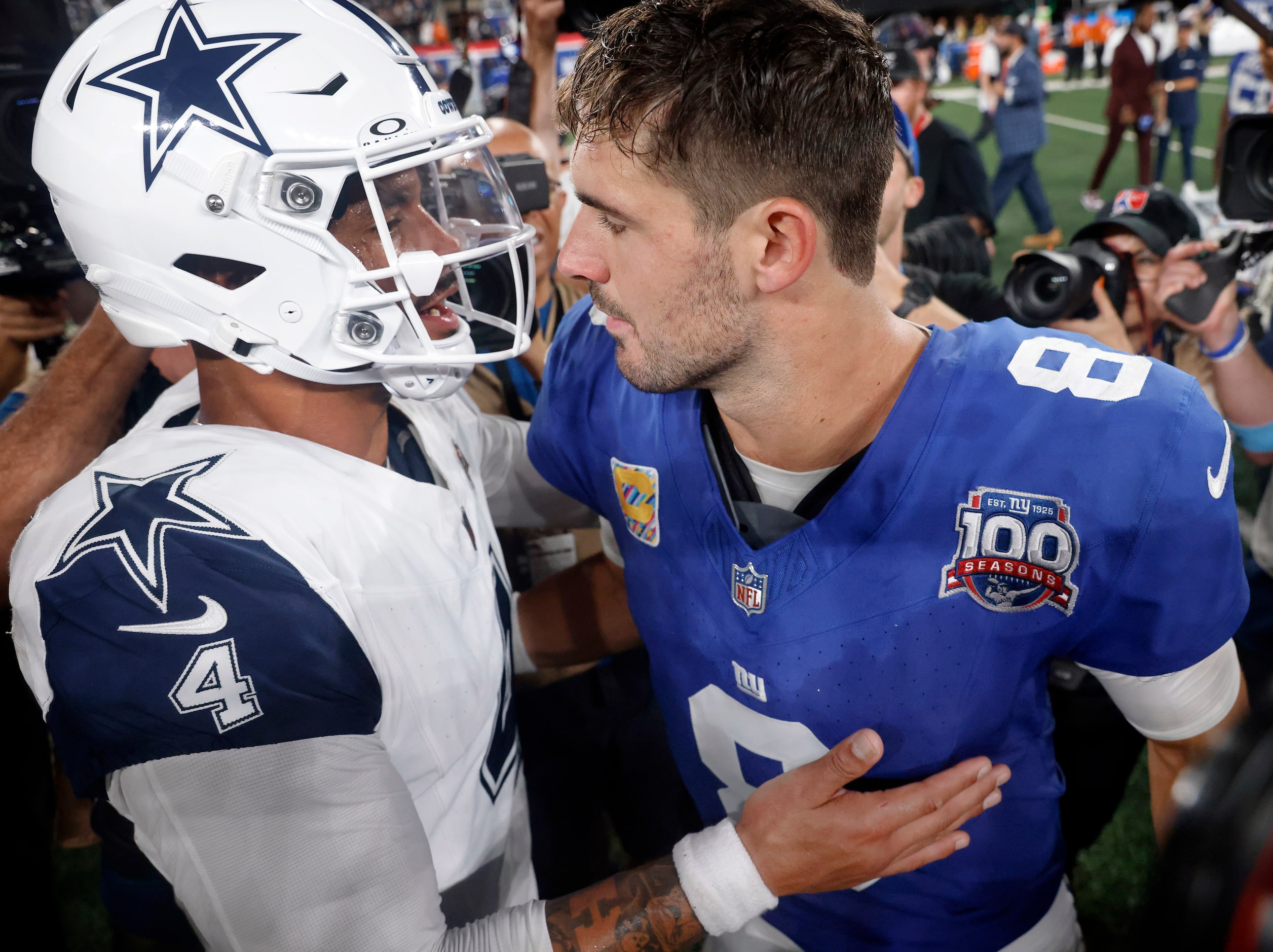 Dallas Cowboys quarterback Dak Prescott (4) and New York Giants quarterback Daniel Jones (8)...