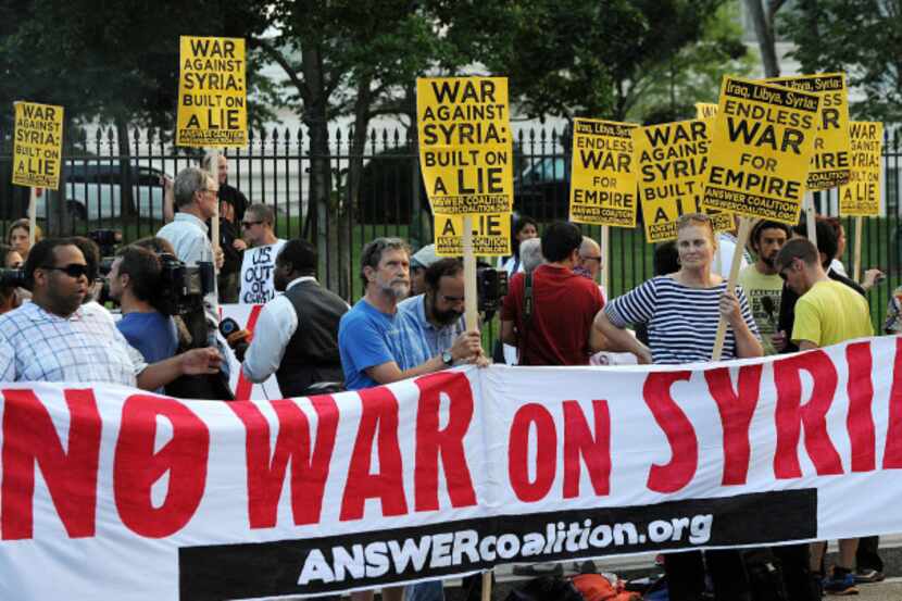 Demonstrators rally on the north side of the White House in Washington, D.C., to protest any...