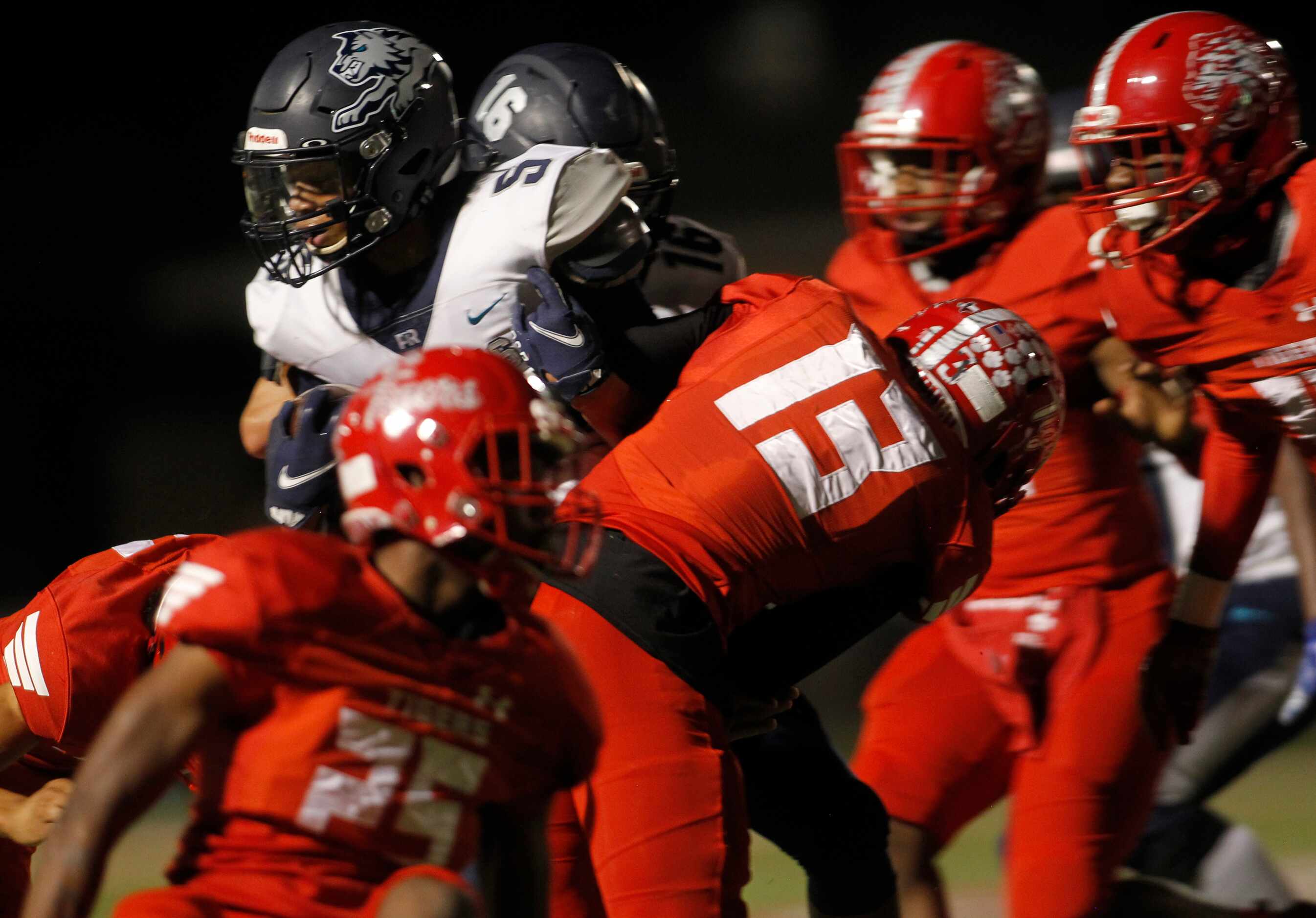 Carrollton Ranchview's Christian Shivers (5), returns a first half kickoff as he is...