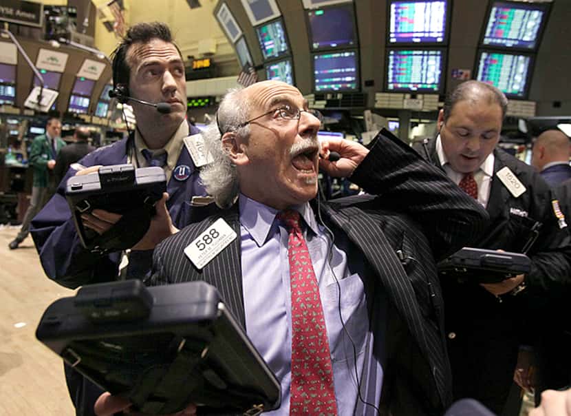 Trader Peter Tuchman, center, works on the floor of the New York Stock Exchange Tuesday,...