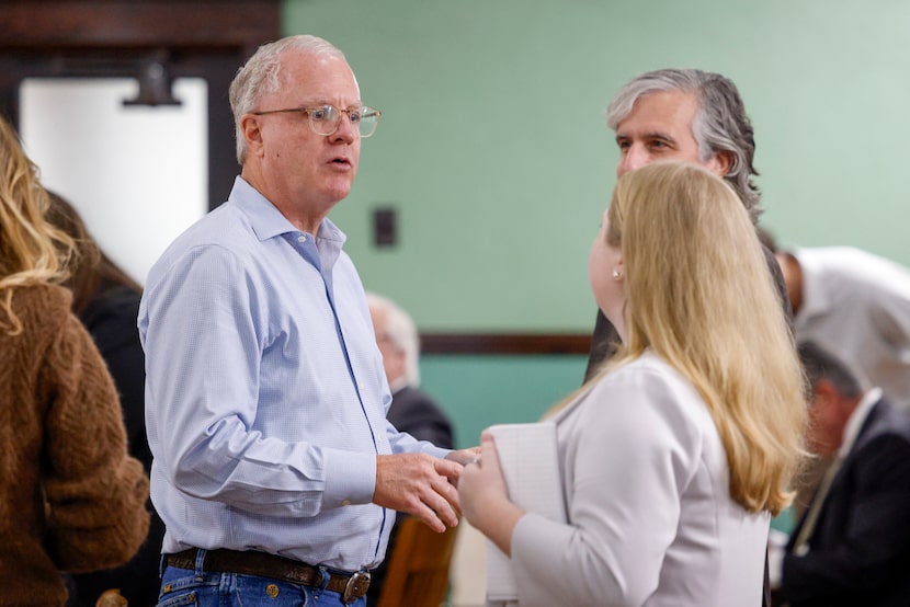 Todd Interests founder and CEO Shawn Todd (left) talks during a break during a special...