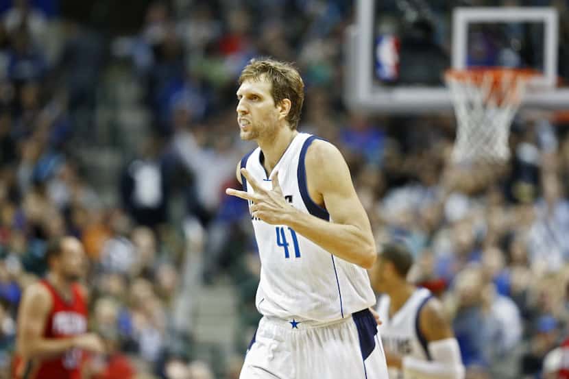 Dirk Nowitzki celebrates after a three pointer against the Pelicans at American Airlines...