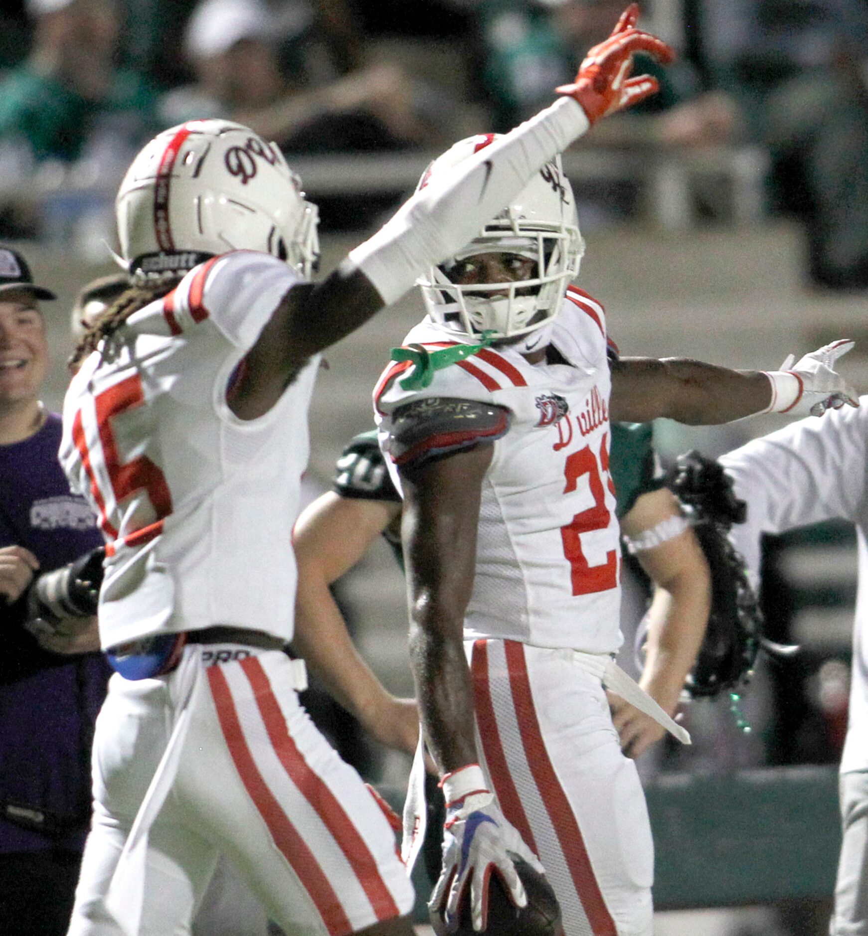 Duncanville defensive back Tyderick Brown (15), left, celebrates Tyren Polley (21)...