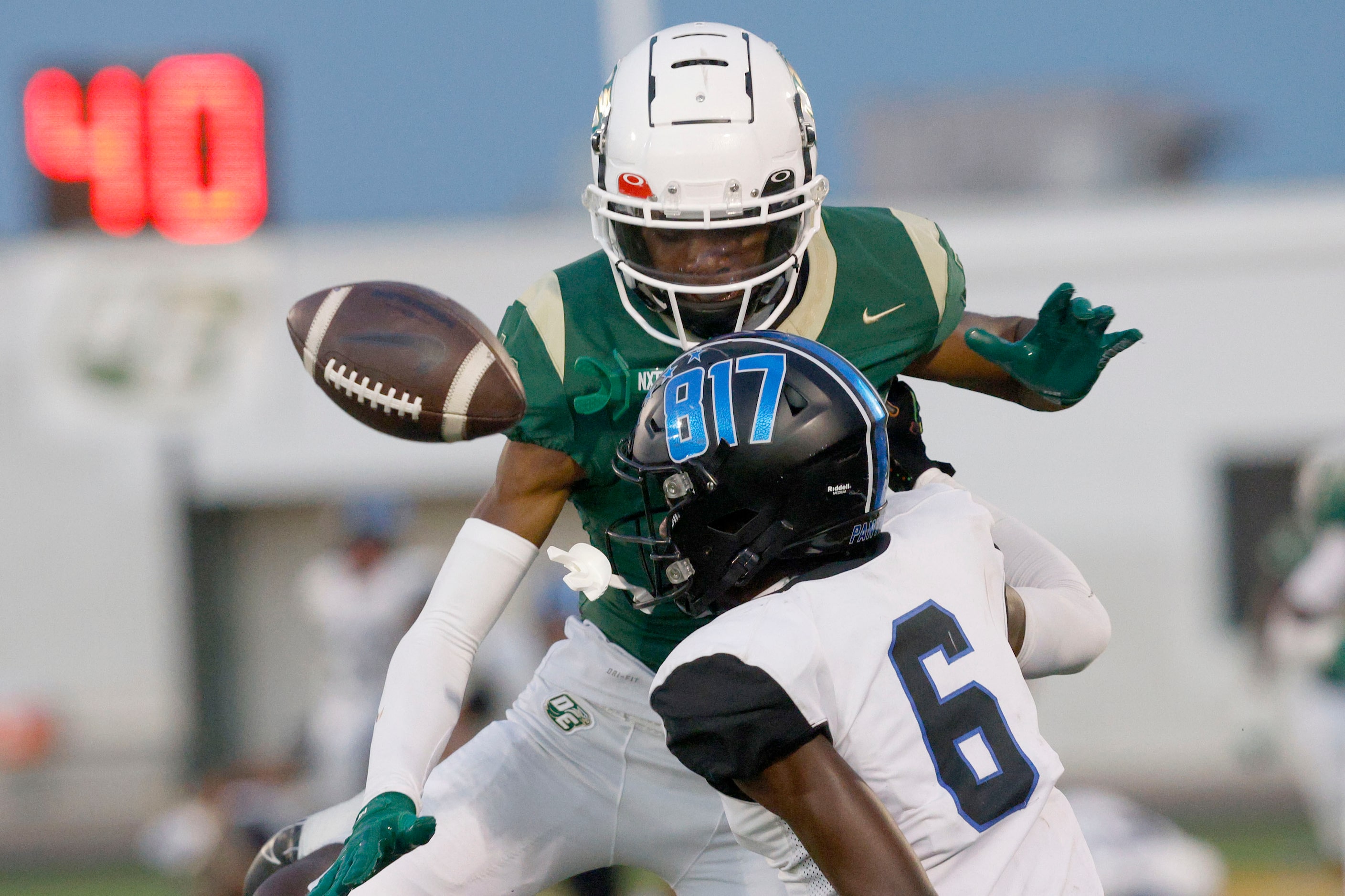 North Crowley's Quentin Gibson fails to make the catch against DeSoto's Jordan Stevens (21)...