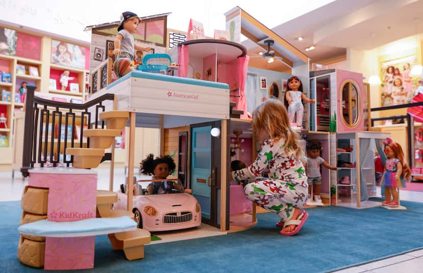 A little girl explores the first official American Girl dollhouse made by Farmers...