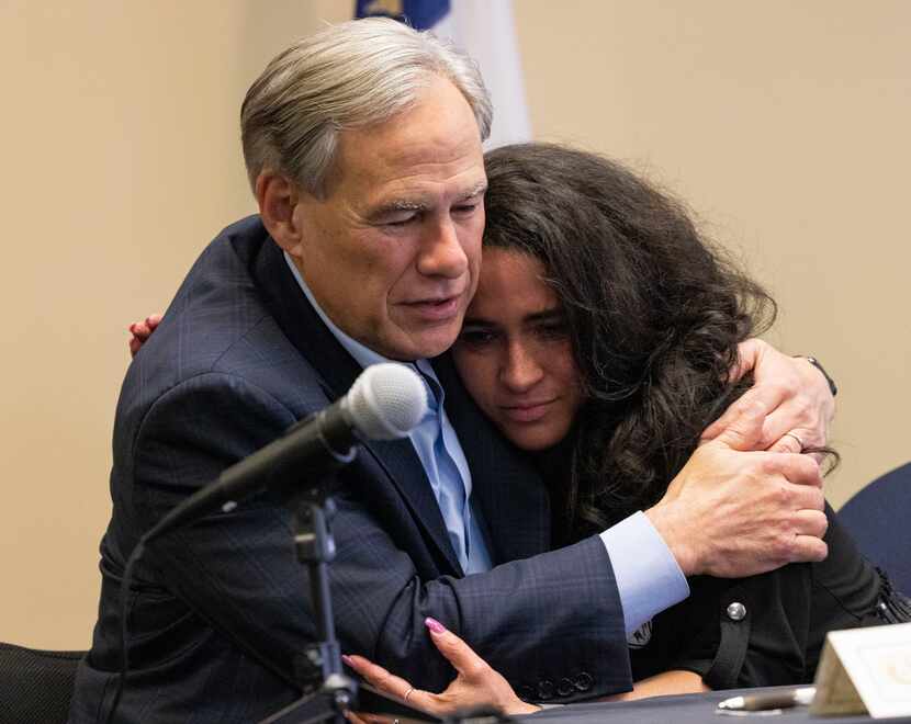 Abbott hugged Stephanie Hellstern, who lost her 16-year-old son to fentanyl poisoning, after...