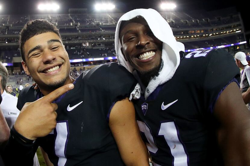FORT WORTH, TX - OCTOBER 21:  (L-R) Kenny Hill #7 of the TCU Horned Frogs celebrates with...