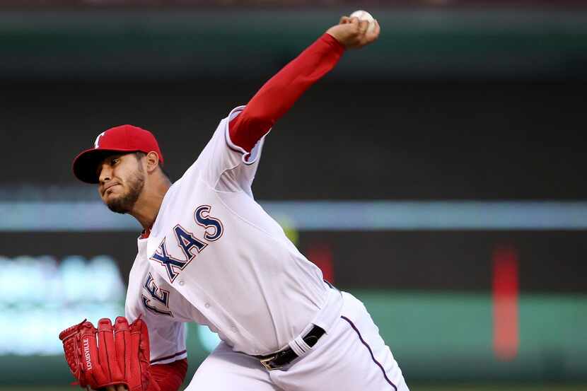 Texas Rangers starting pitcher Martin Perez (33) throws in the 1st inning of MLB Baseball...