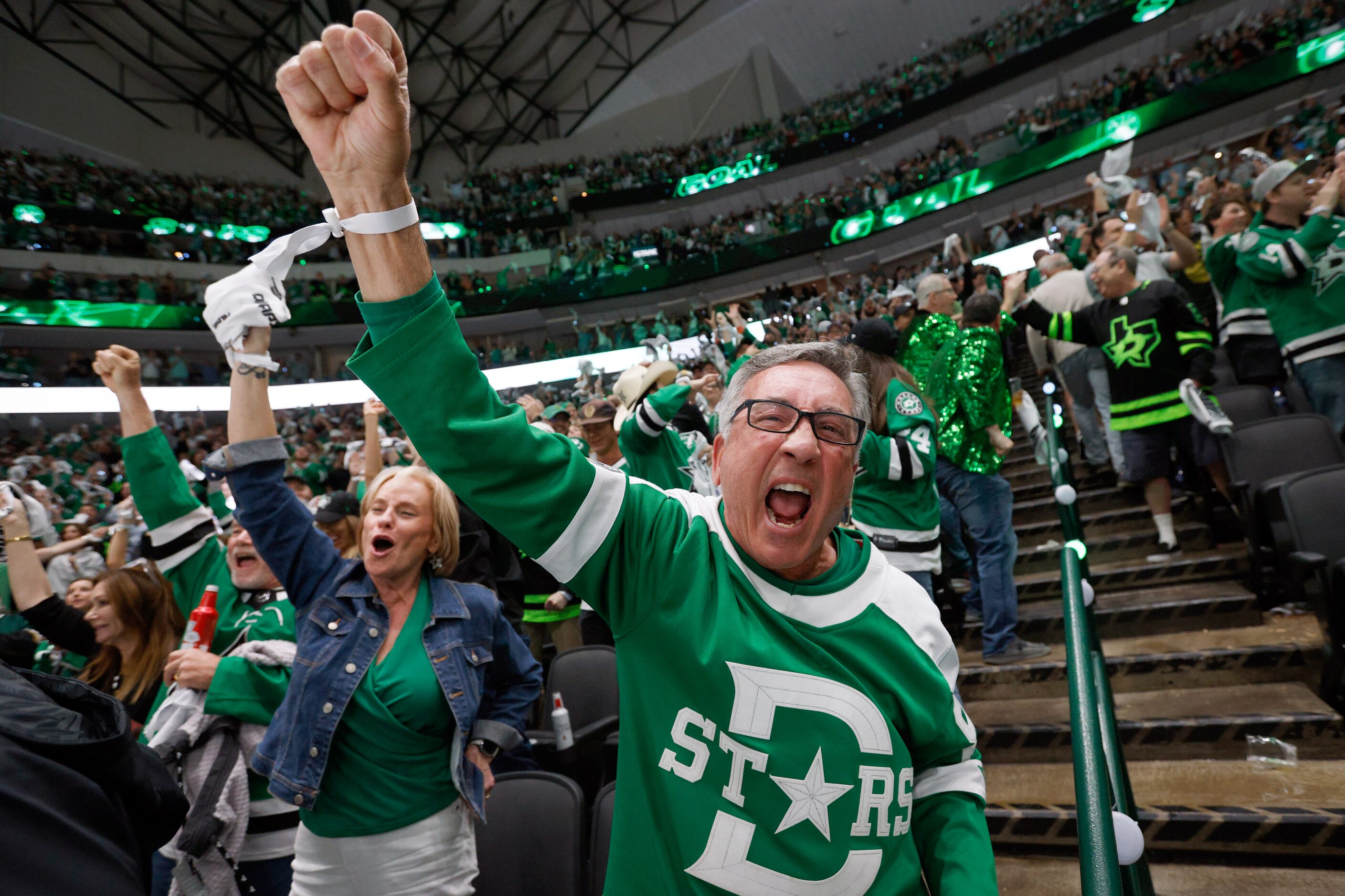 Steve Jebbia celebrates an empty-net goal by Dallas Stars defenseman Esa Lindell during the...