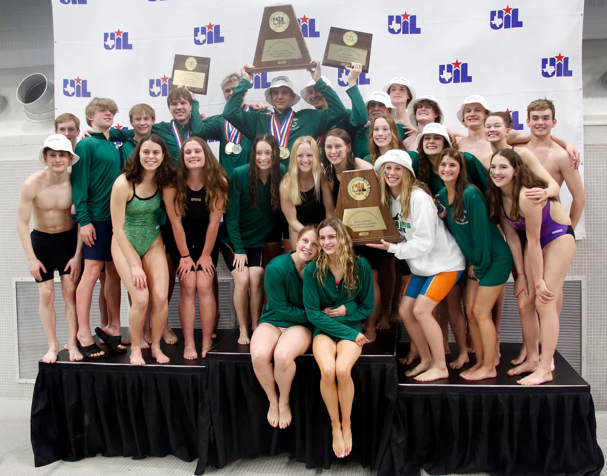 Members of the Southlake Carroll boys and girls swim and diving teams combined for a large...